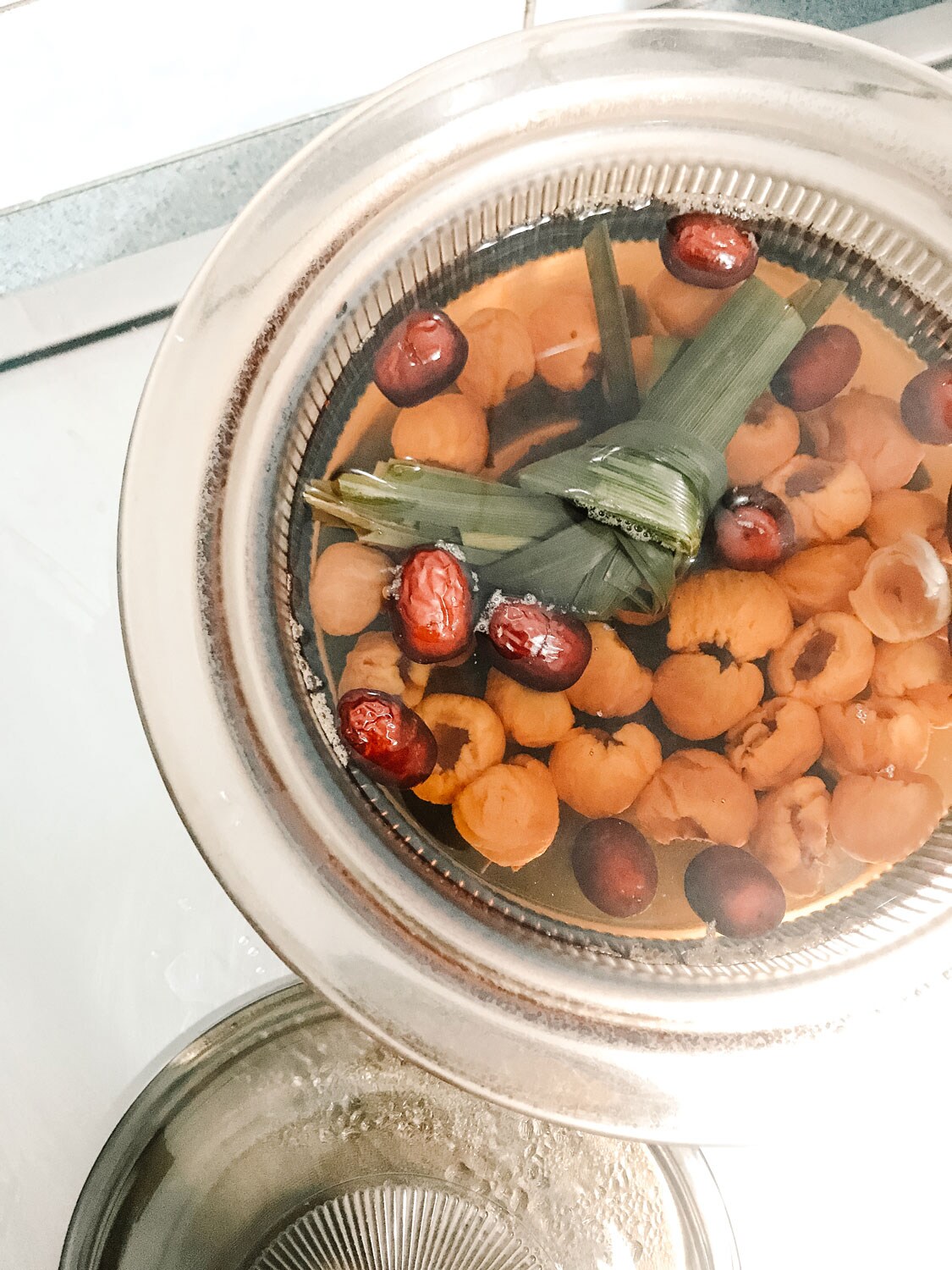 A large, filled pot resting on a stove.