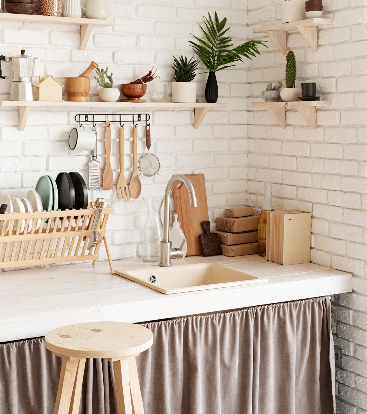 A kitchen countertop featuring wooden accessories.