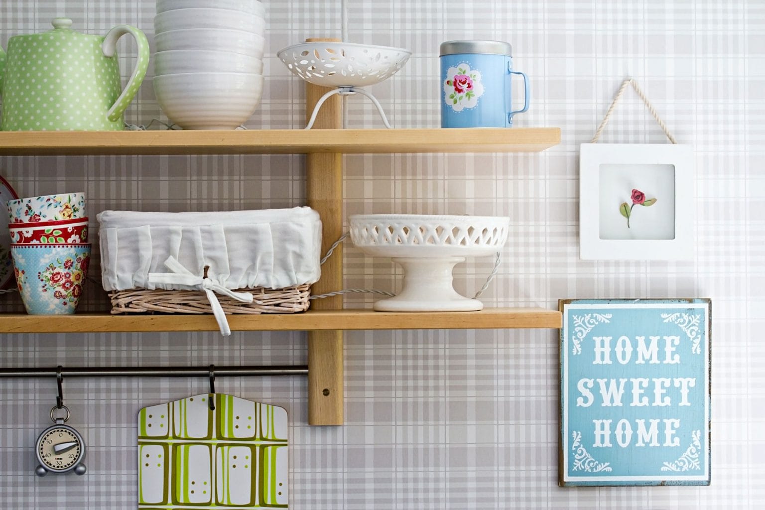Shelves displaying dishes and other kitchen items.