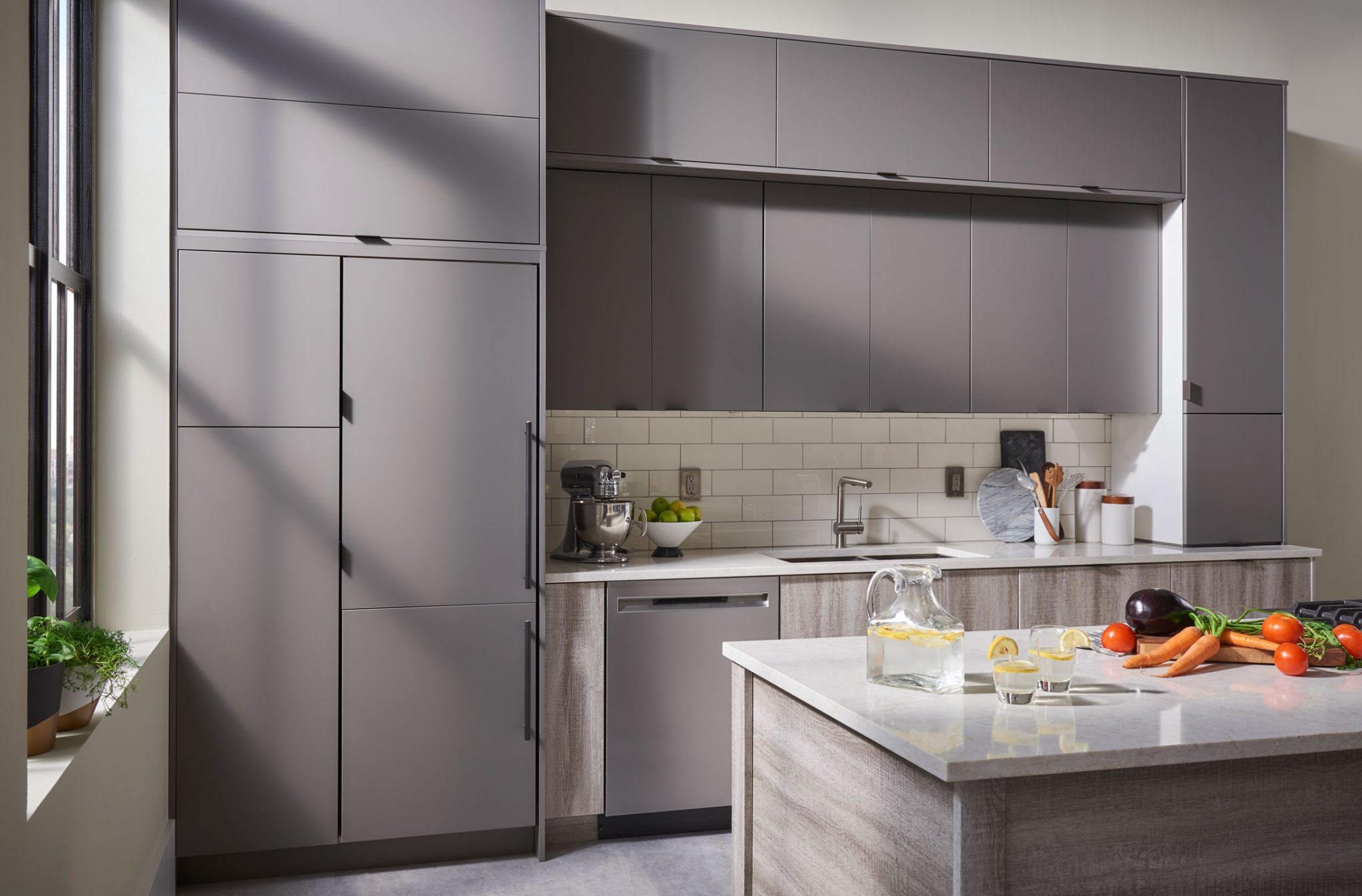 A gray kitchen with smooth finishes.