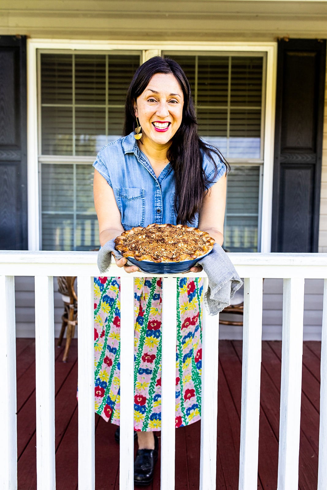 Holding out a pie for all to see.