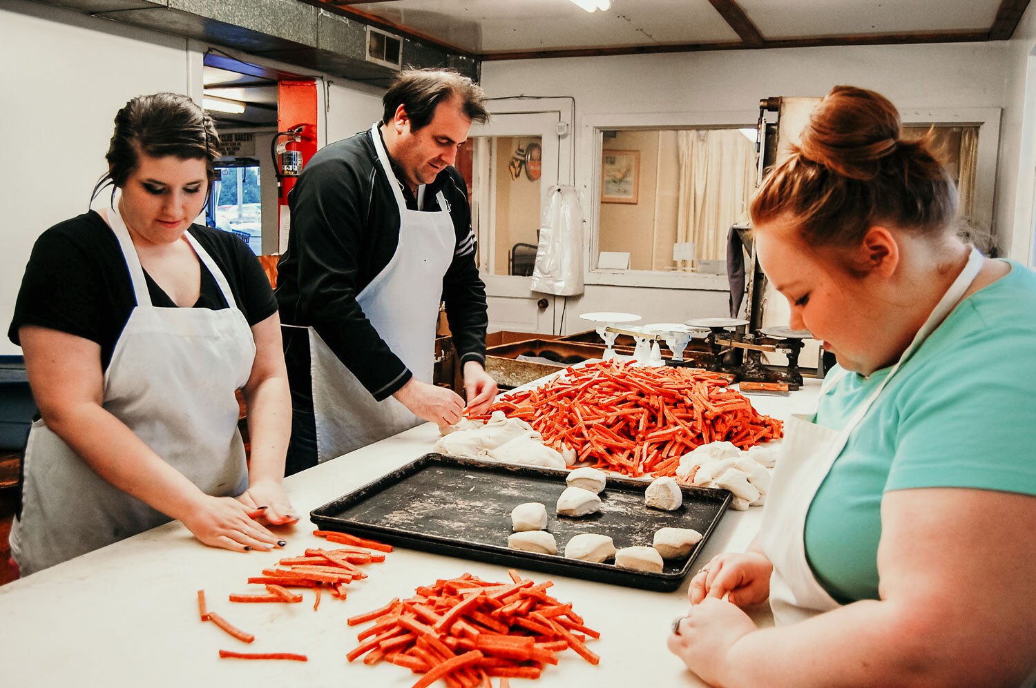 People making pepperoni rolls.