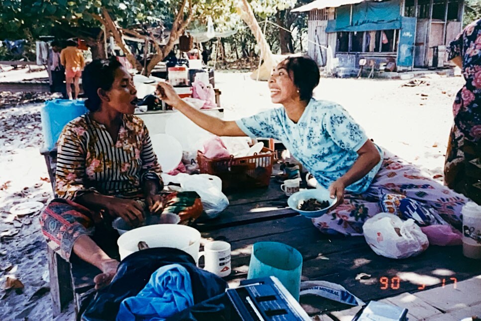 Firdaus Sani’s family enjoying food together.