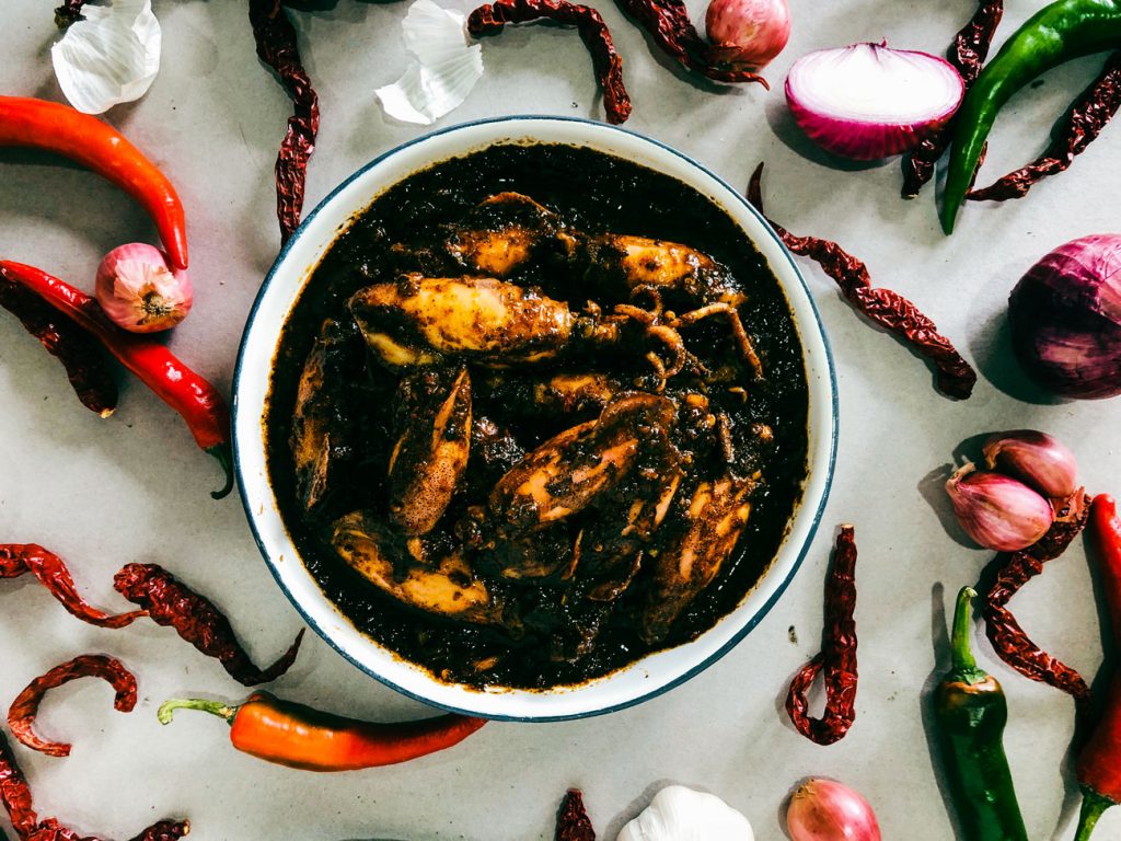 A bowl of sotong hitam, squid in squid ink.