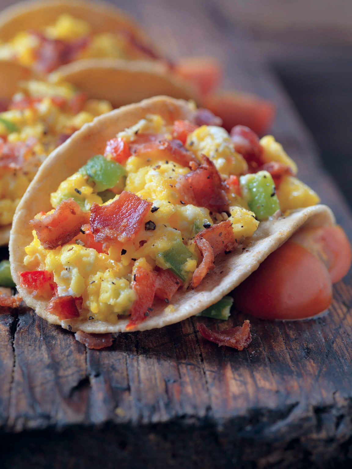 A classic breakfast taco with scrambled eggs, bacon and peppers.