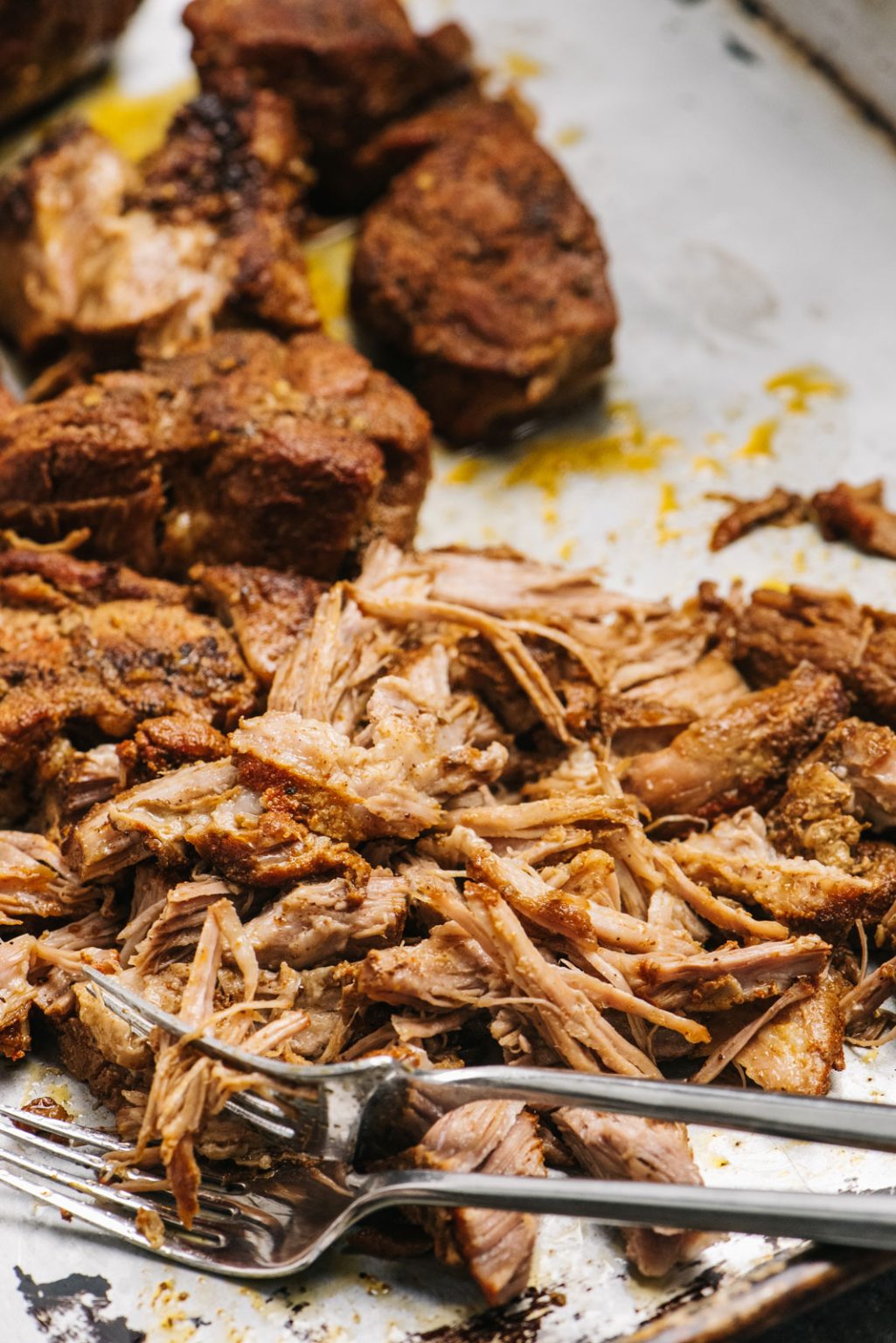 Cooked pork shredded into pulled pork.