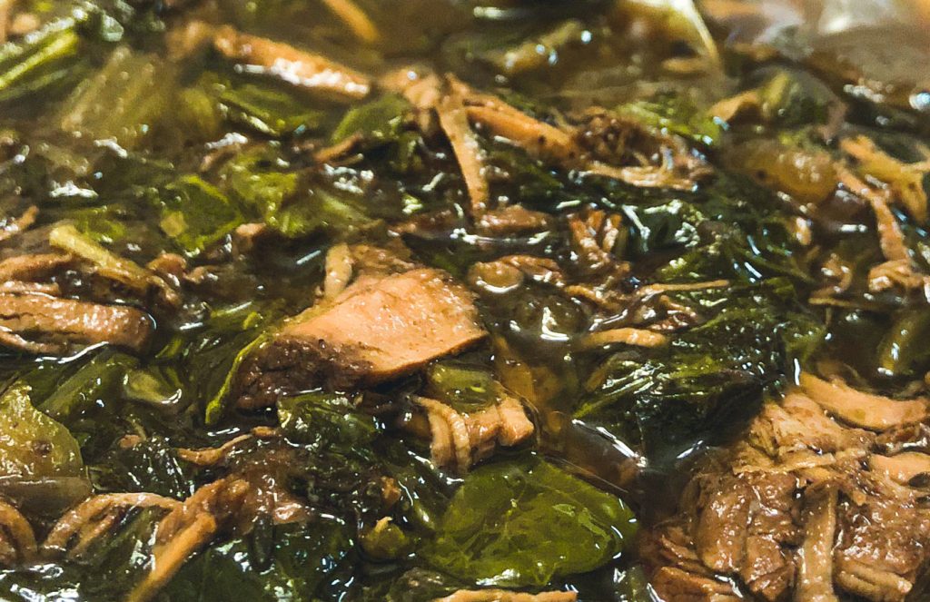 A close-up view of pepperpot stew.
