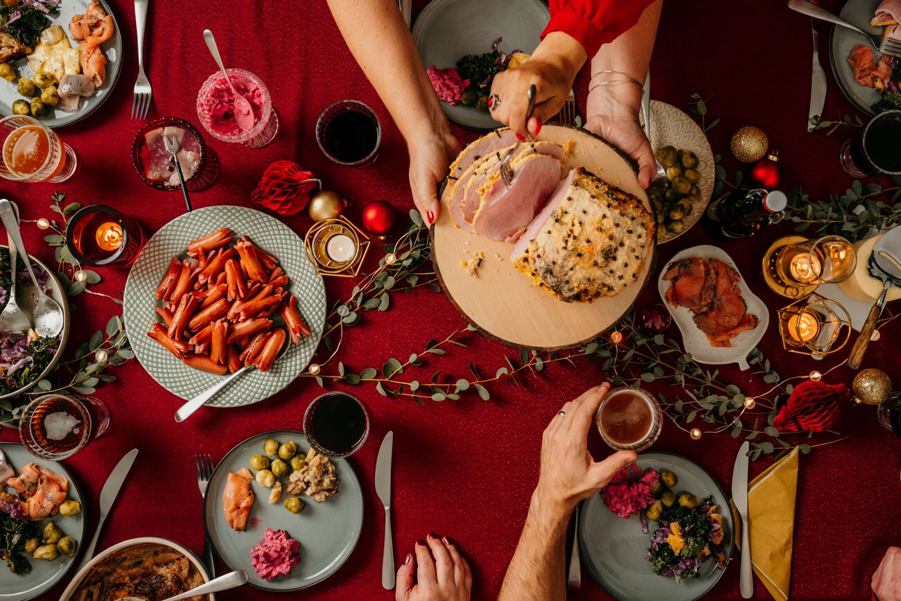A dining room table covered in festive dishes and decor.