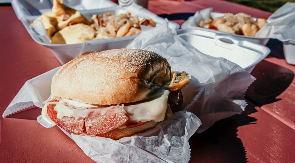 Three takeaway containers filled with fresh eats.