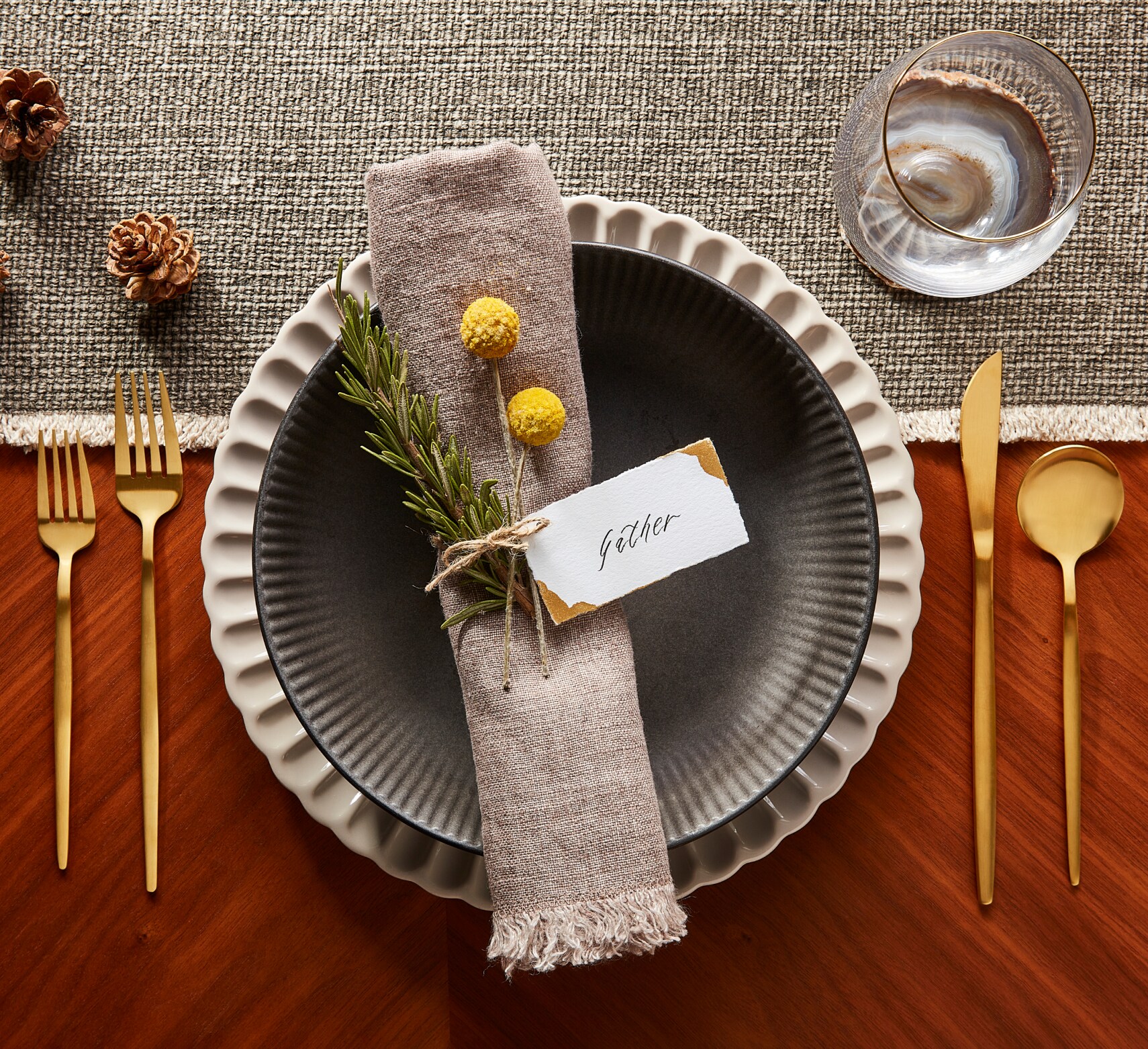 Table setting with a cloth napkin decorated with a flower
