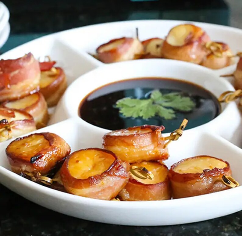Bacon wrapped scallops on a serving tray