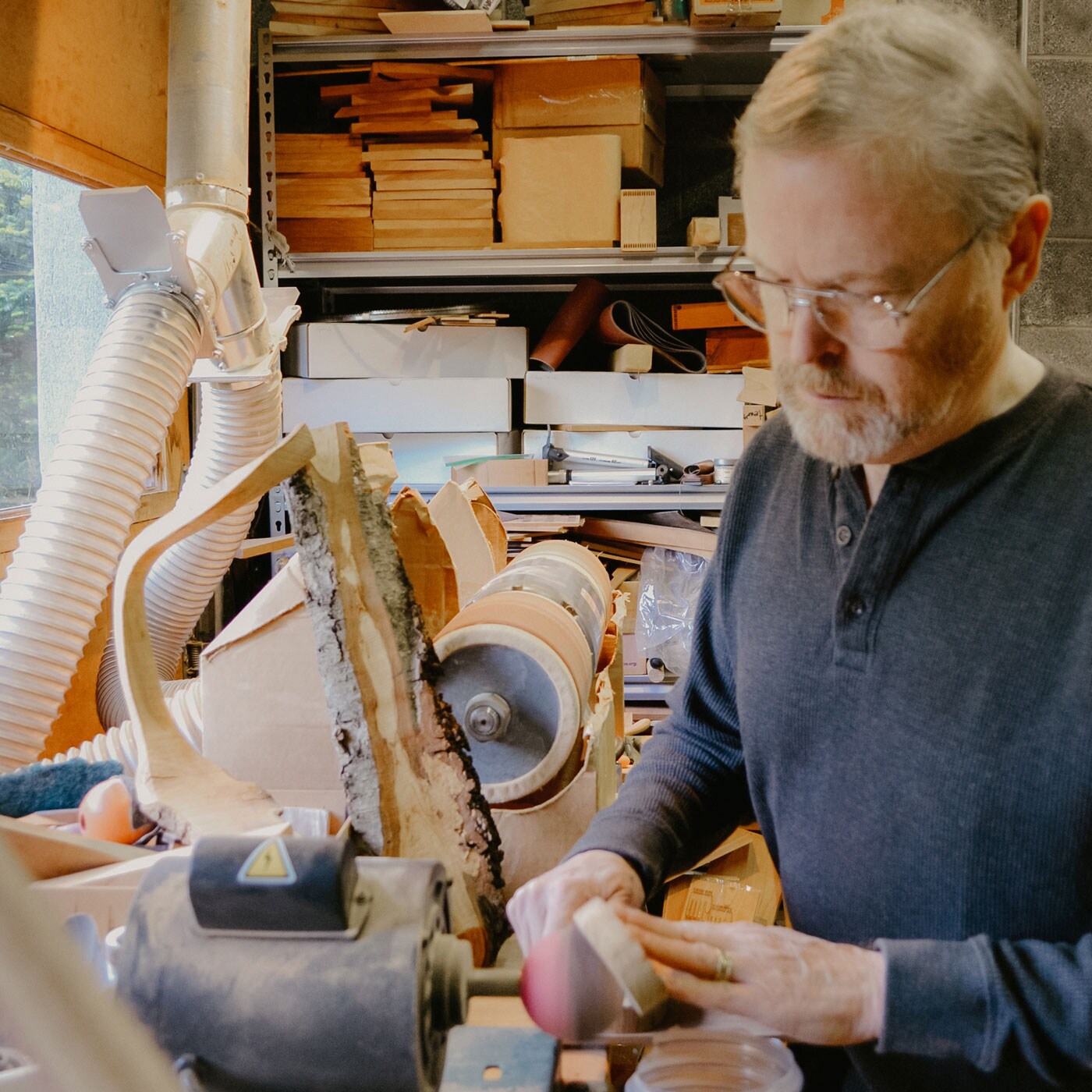 Jonathan Simons working with his tools.