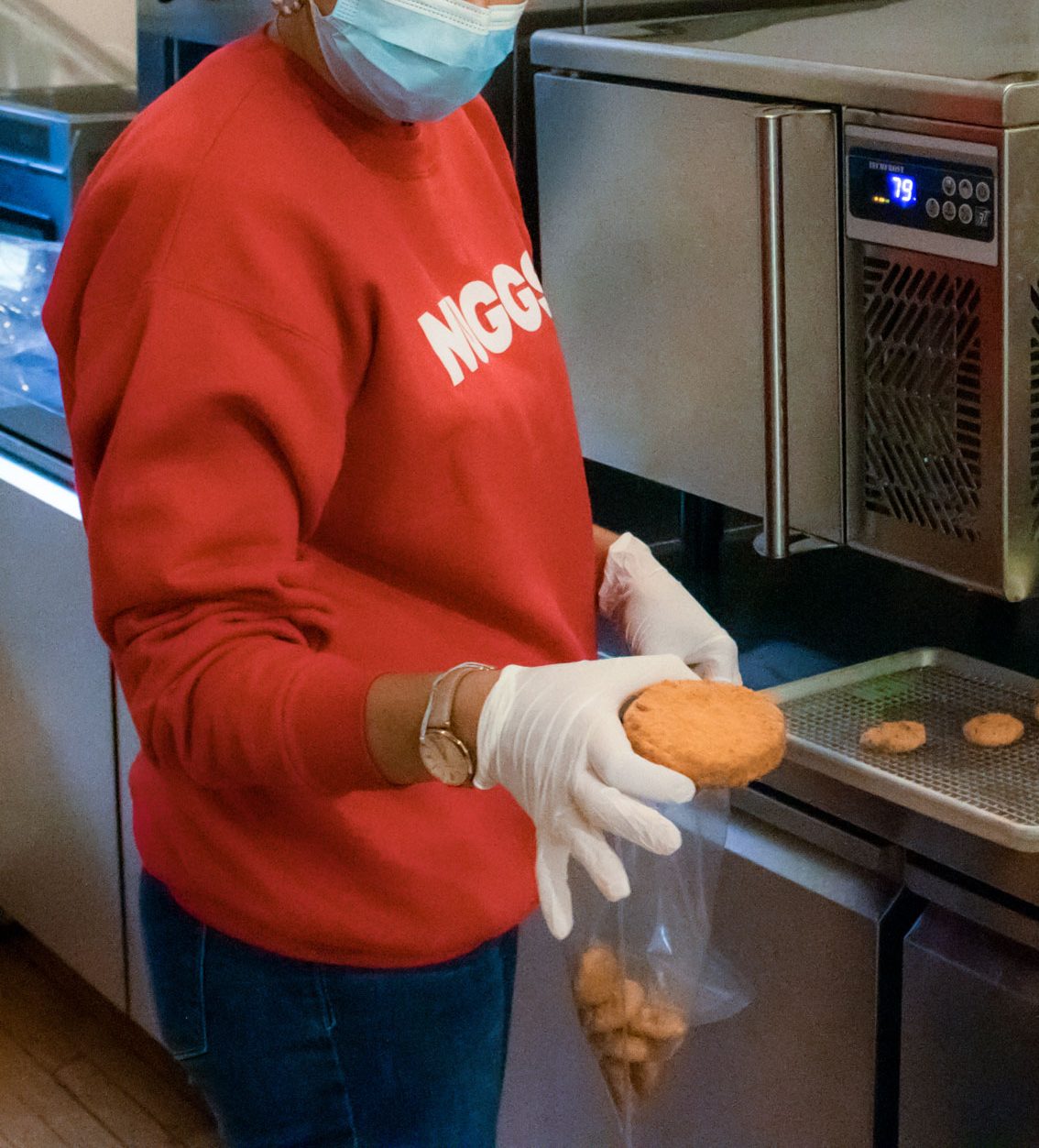 A person holding a plant-based chicken patty.