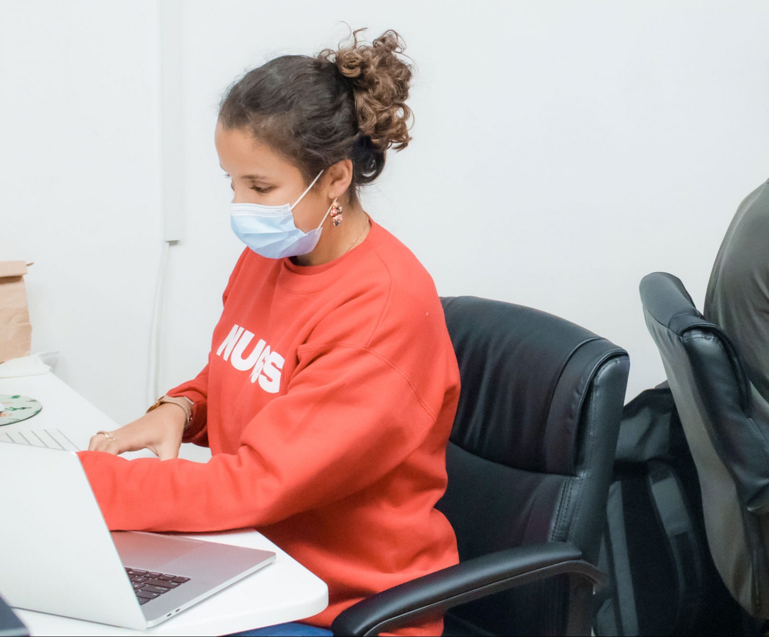 Gabriela, a Nuggs food engineer, working at her desk.