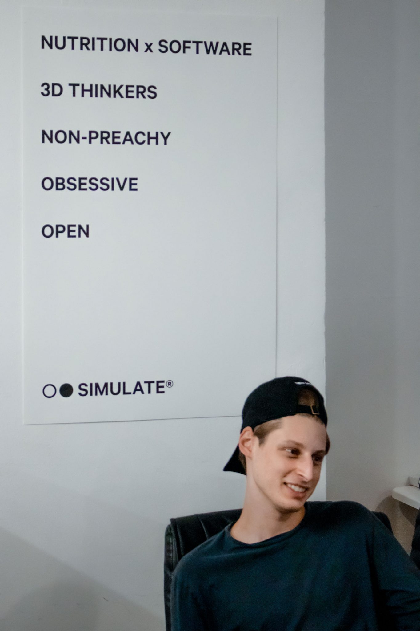 The young Ben Pasternak sitting in an office chair.