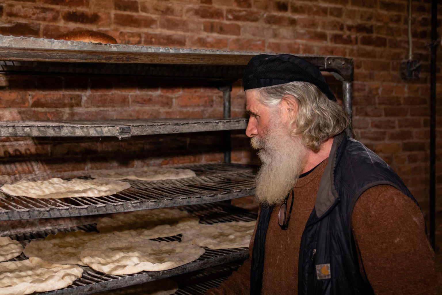 Richard Bourdon examining his work.