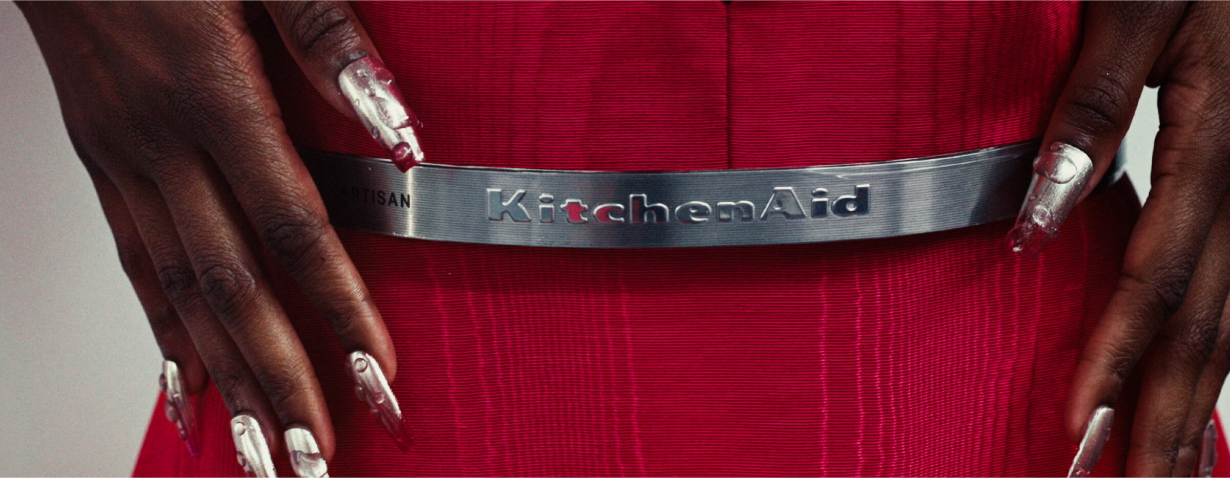 A close up of the KitchenAid® logo on a trimband belt.