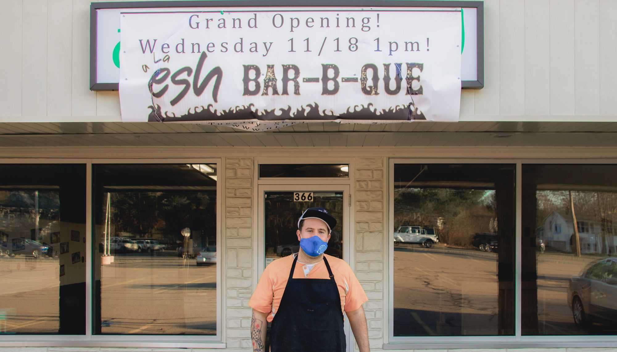Avi Shemtov standing in front of his restaurant, A La Esh.
