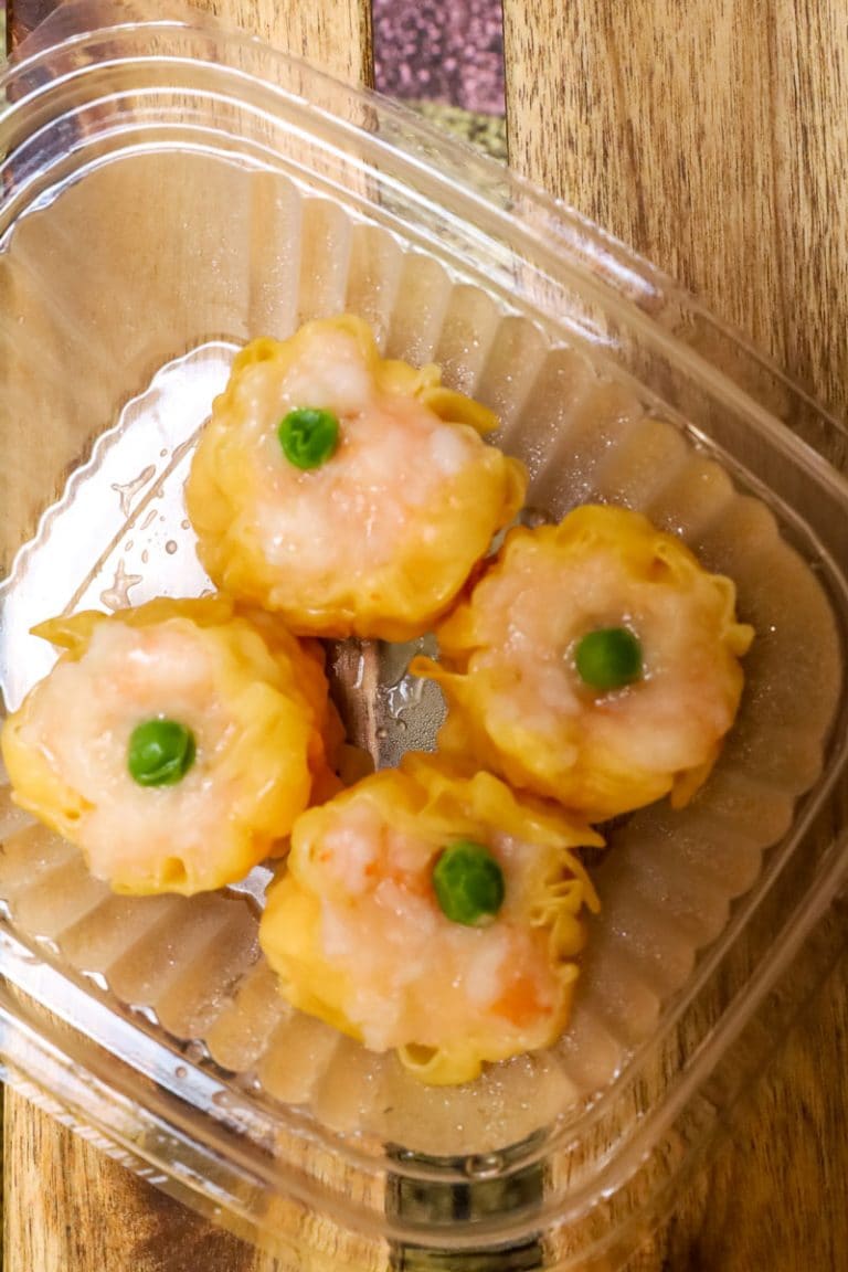 A clear container of food.