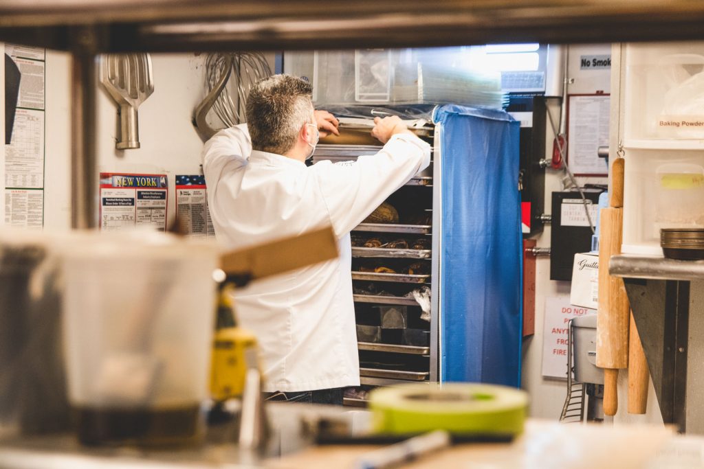 Chef Christophe Toury placing the chocolate into his baker's rack.