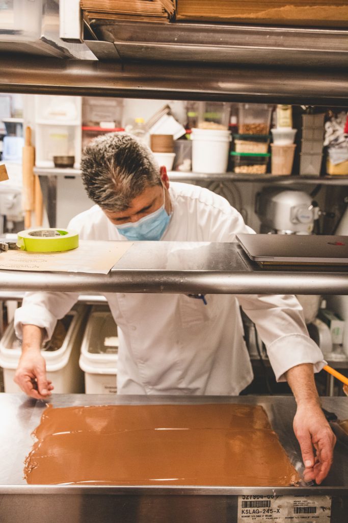 Chef Christophe Toury examining his chocolate.