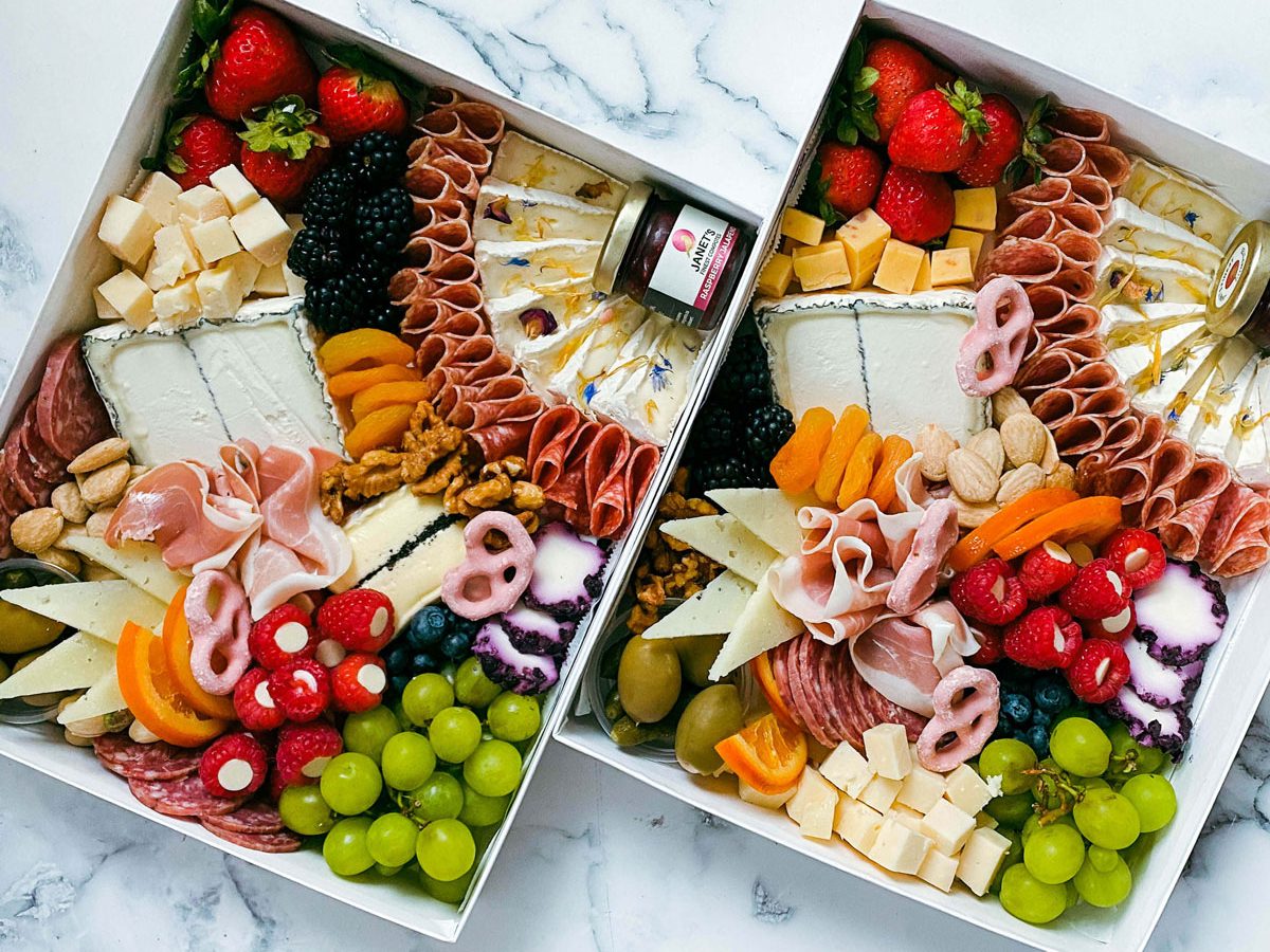 Two large, overflowing picnic boxes.