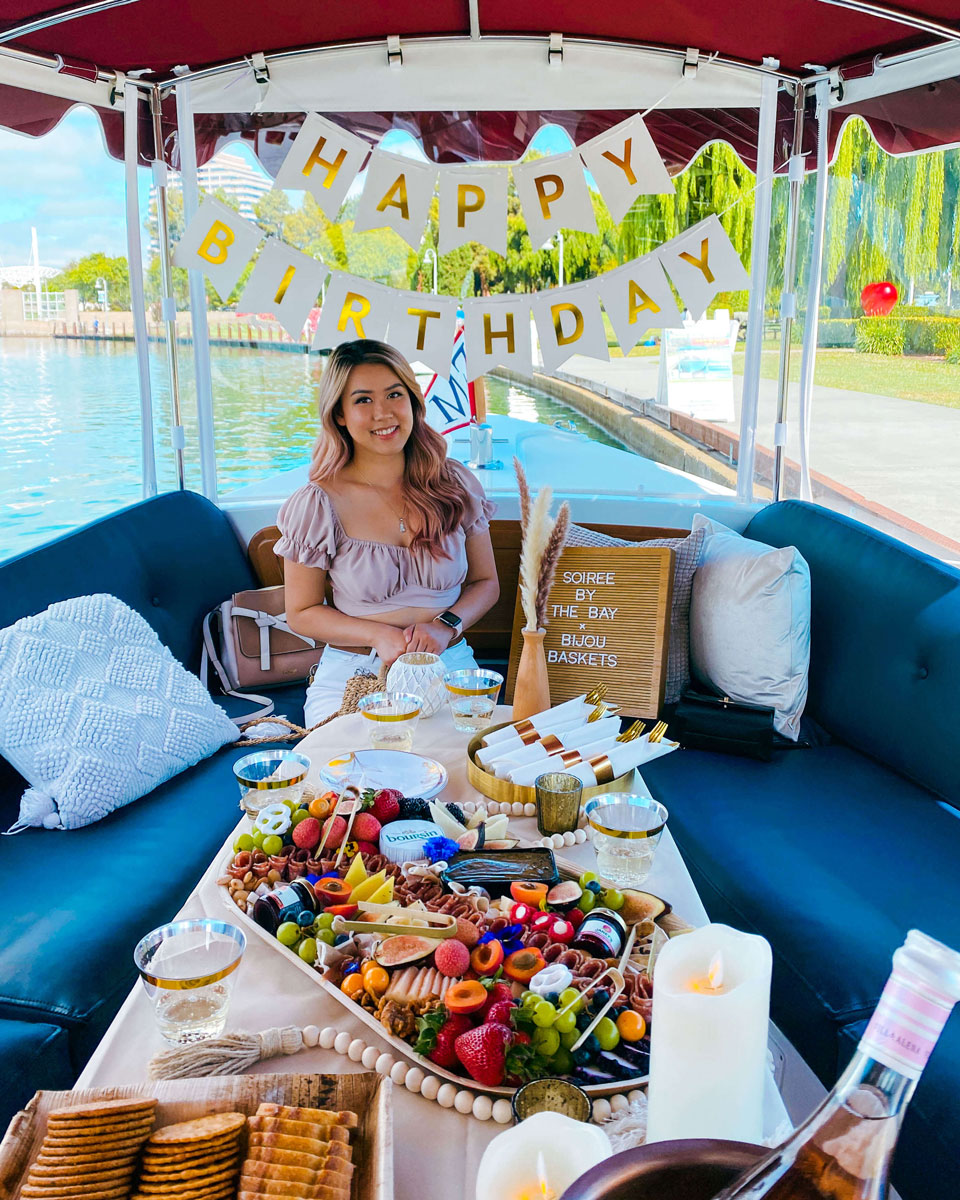 A person sitting in a boat posing for a photo.