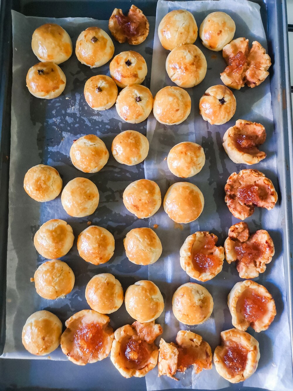 Baked pastries resting on a baking sheet.