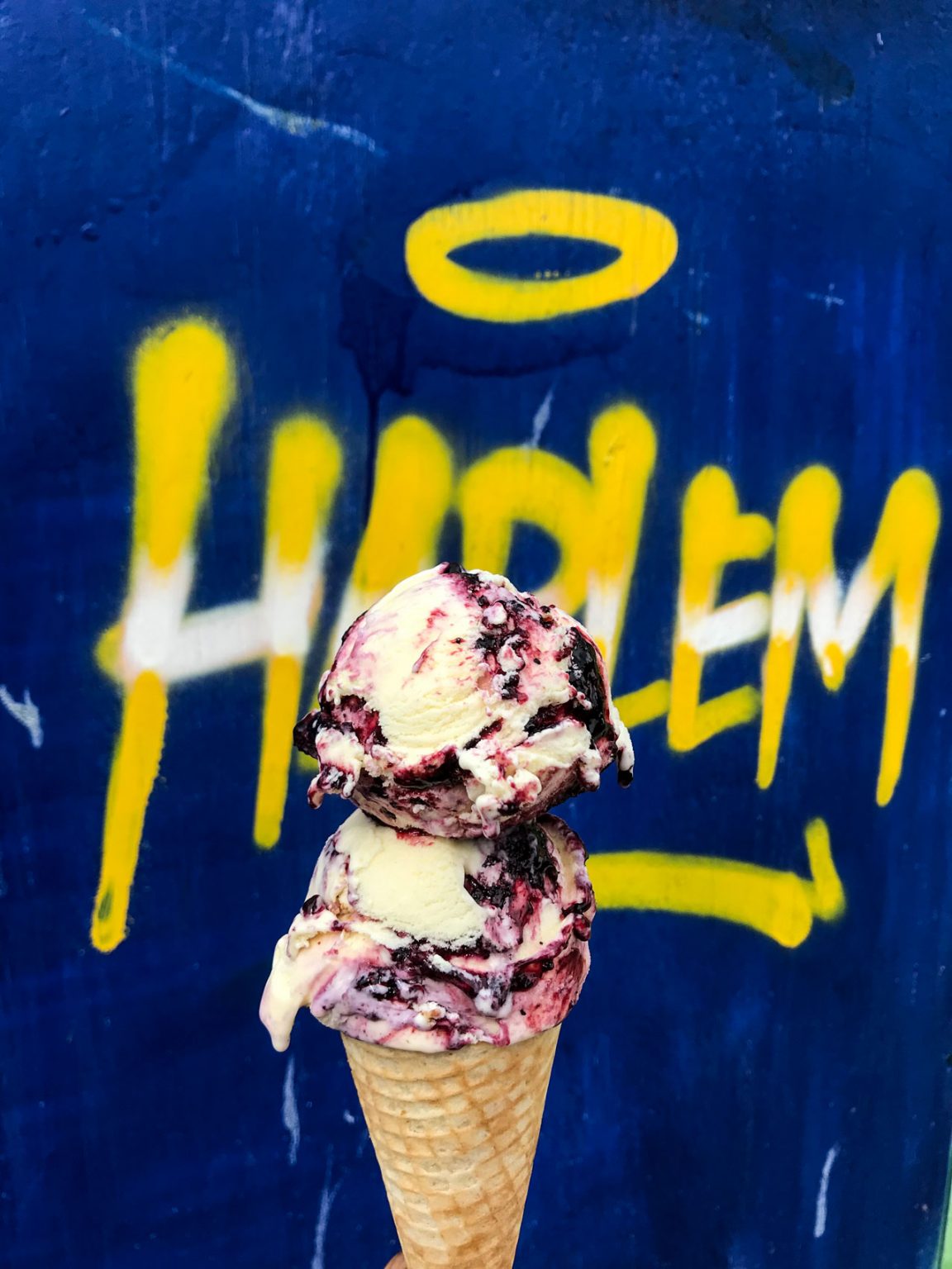 Two scoops of ice cream on an ice cream cone.