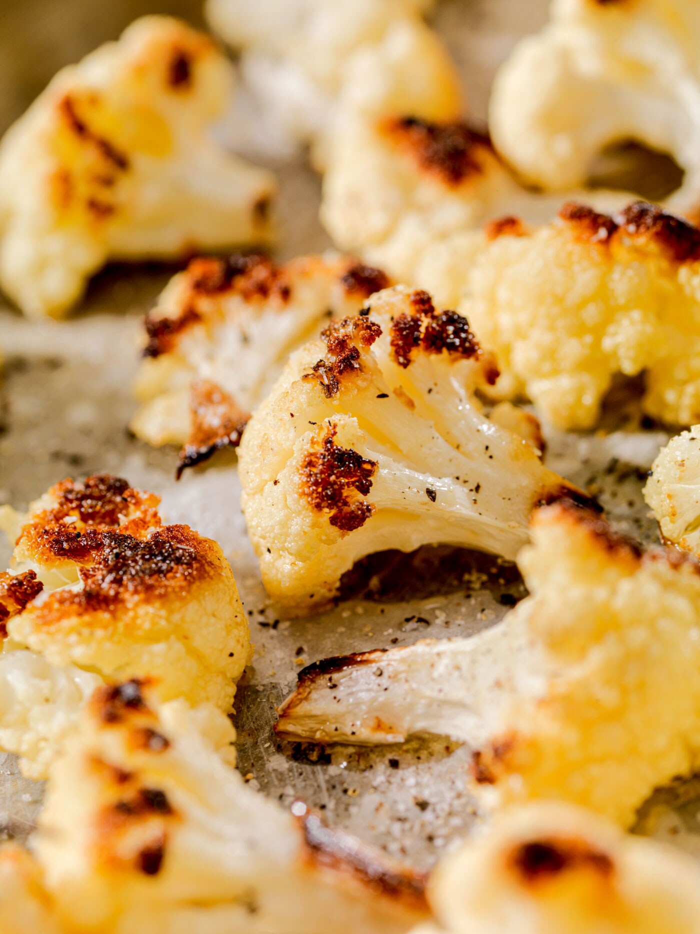 Roasted cauliflower sprinkled with seasonings.