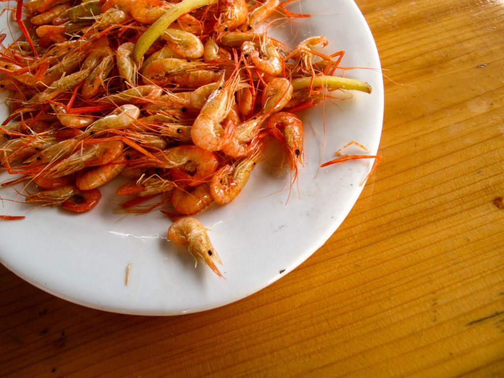 Whole cooked shrimp.