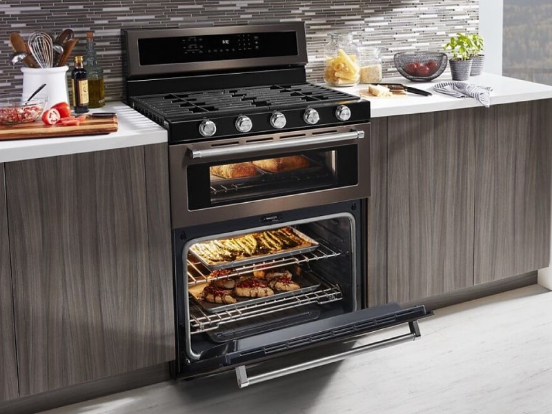 Various dishes cooking in a gas oven range Various dishes cooking in a gas oven range