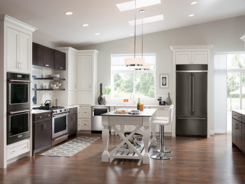 Open kitchen with a KitchenAid® double wall oven, gas range and built-in French-door refrigerator Open kitchen with a KitchenAid® double wall oven, gas range and built-in French-door refrigerator