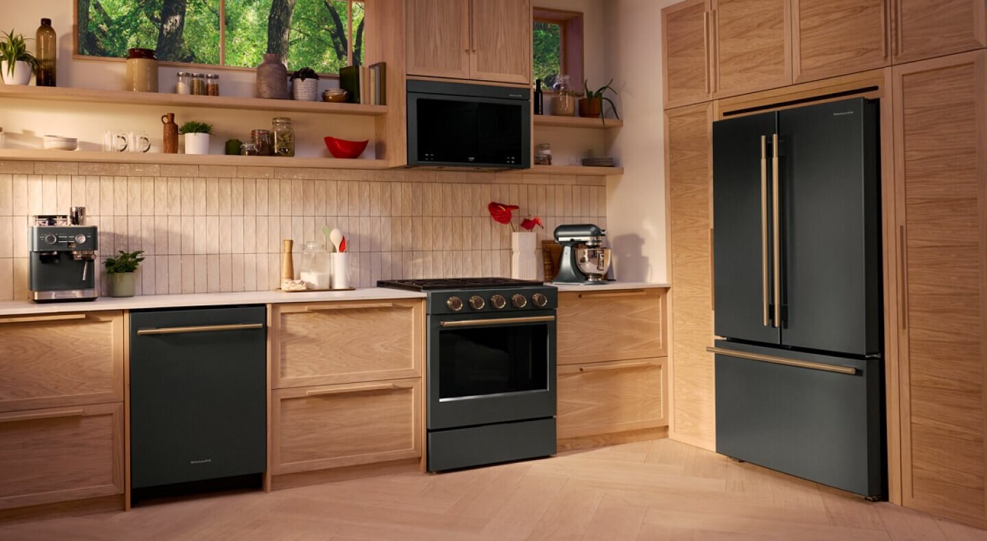 Suite of KitchenAid® Juniper appliances in wood cabinetry