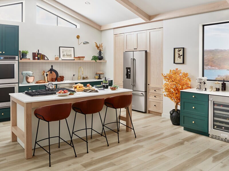 A trendy, stylish kitchen with teal cabinetry and a suite of KitchenAid® appliances A trendy, stylish kitchen with teal cabinetry and a suite of KitchenAid® appliances