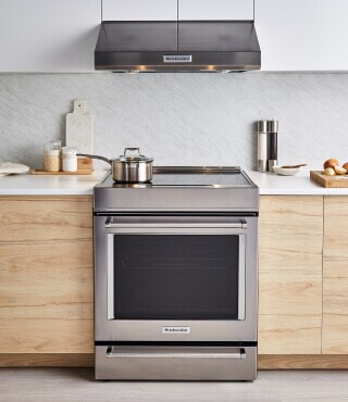 A KitchenAid® range and over-the-range microwave in a modern kitchen