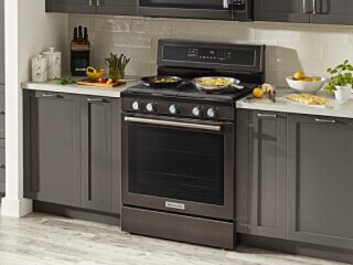 KitchenAid® oven set in gray cabinetry