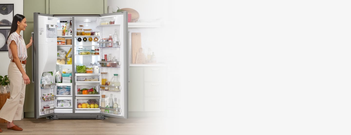 Side-by-side refrigerator filled with fresh and frozen food