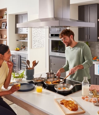 Person cooking on an electric cooktop