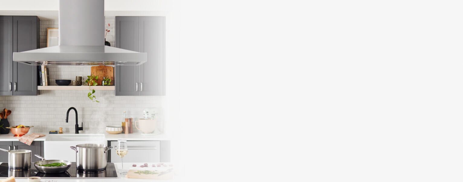 Island-mount kitchen hood in a bright kitchen