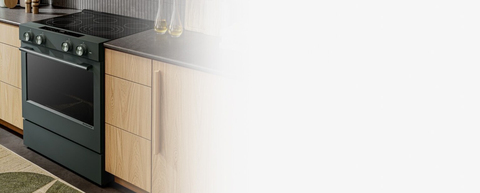 A Juniper range next to brown cabinets