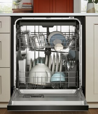 An opened dishwasher with dishes inside