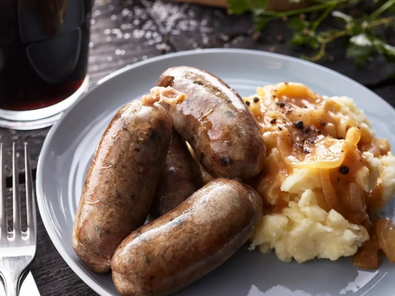 Sausage and mashed potatoes covered with gravy