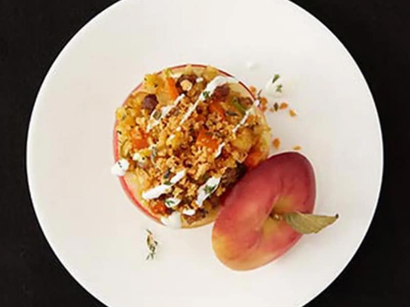 Sweet potato stuffed apple on white plate
