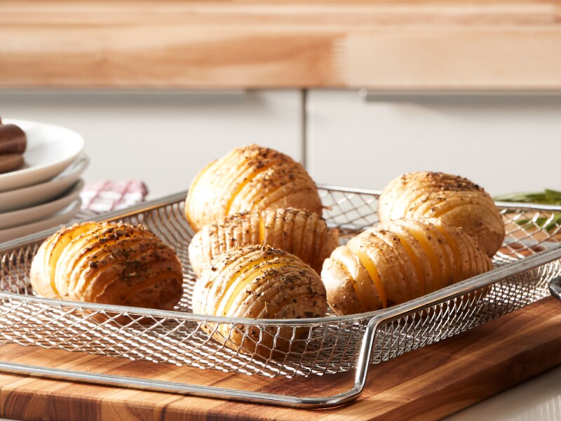 Hasselback potatoes on wire mesh tray  Hasselback potatoes on wire mesh tray