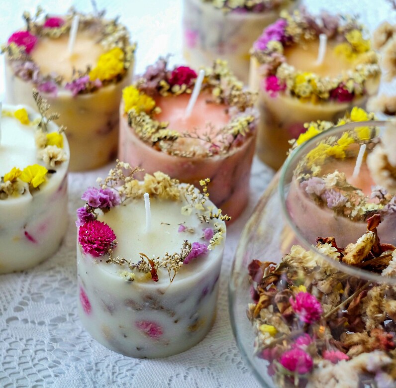 Candles made with flower petals infused into the wax and garnished around the rim of the candle.