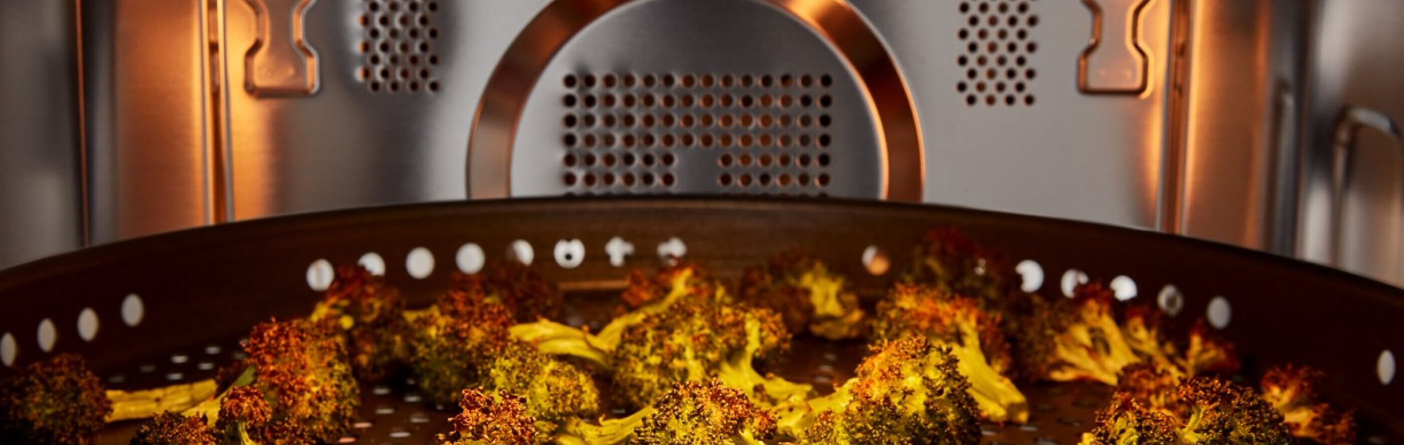 Broccoli air frying in a microwave cavity
