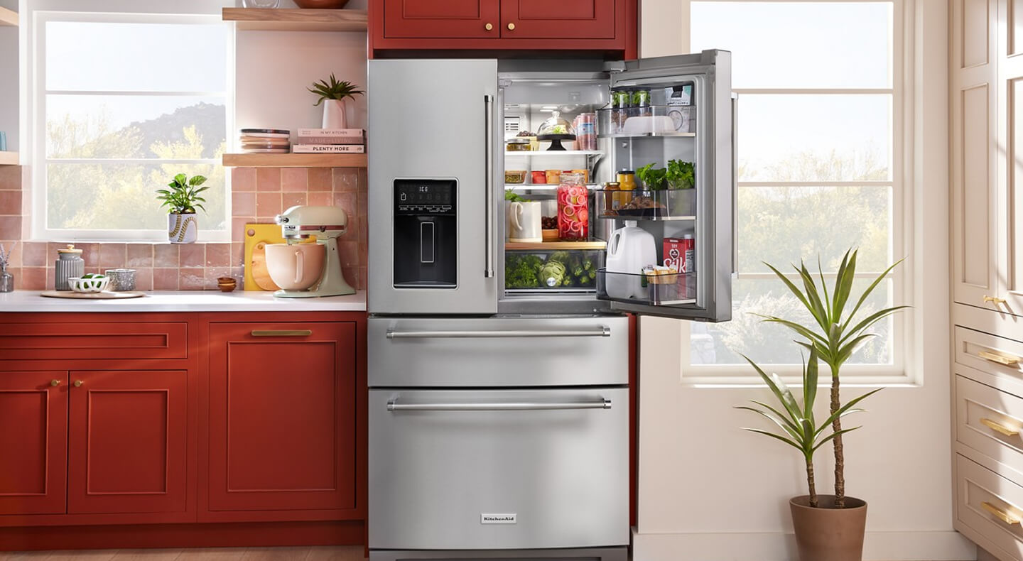 Open stainless steel KitchenAid® four door refrigerator with fresh food inside Open stainless steel KitchenAid® four door refrigerator with fresh food inside
