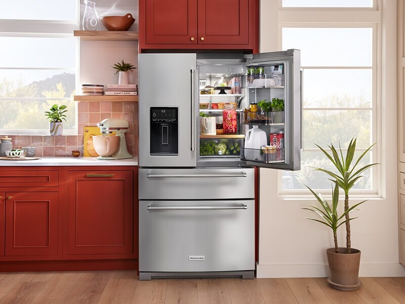 Open stainless steel KitchenAid® four door refrigerator with fresh food inside Open stainless steel KitchenAid® four door refrigerator with fresh food inside