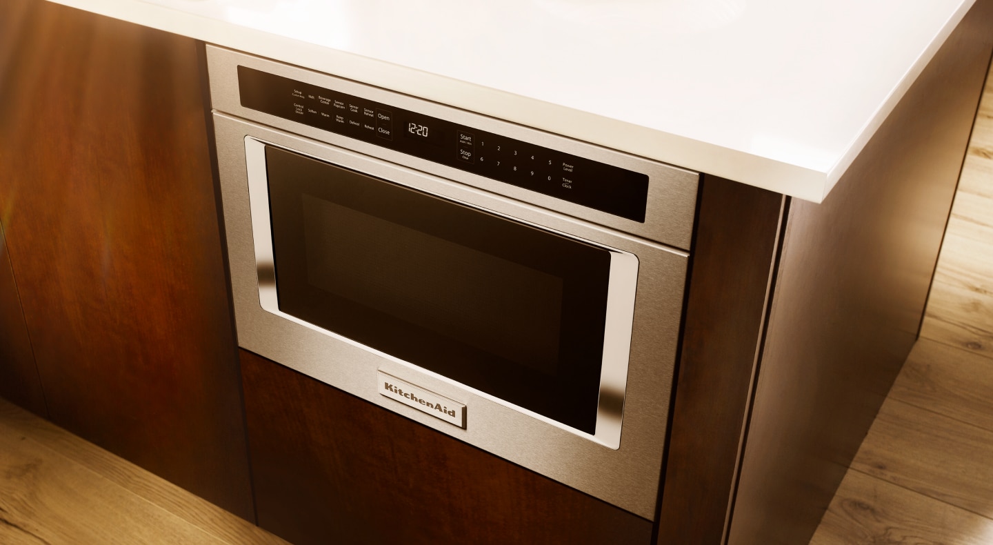 A KitchenAid® microwave drawer installed below the countertop A KitchenAid® microwave drawer installed below the countertop
